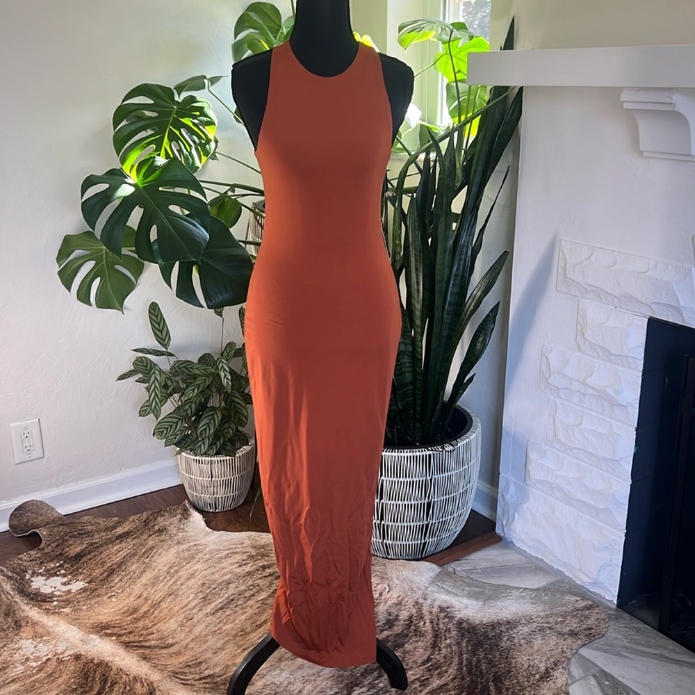 Russet colored sleeveless dress , tank style, low back opening. Low back slit